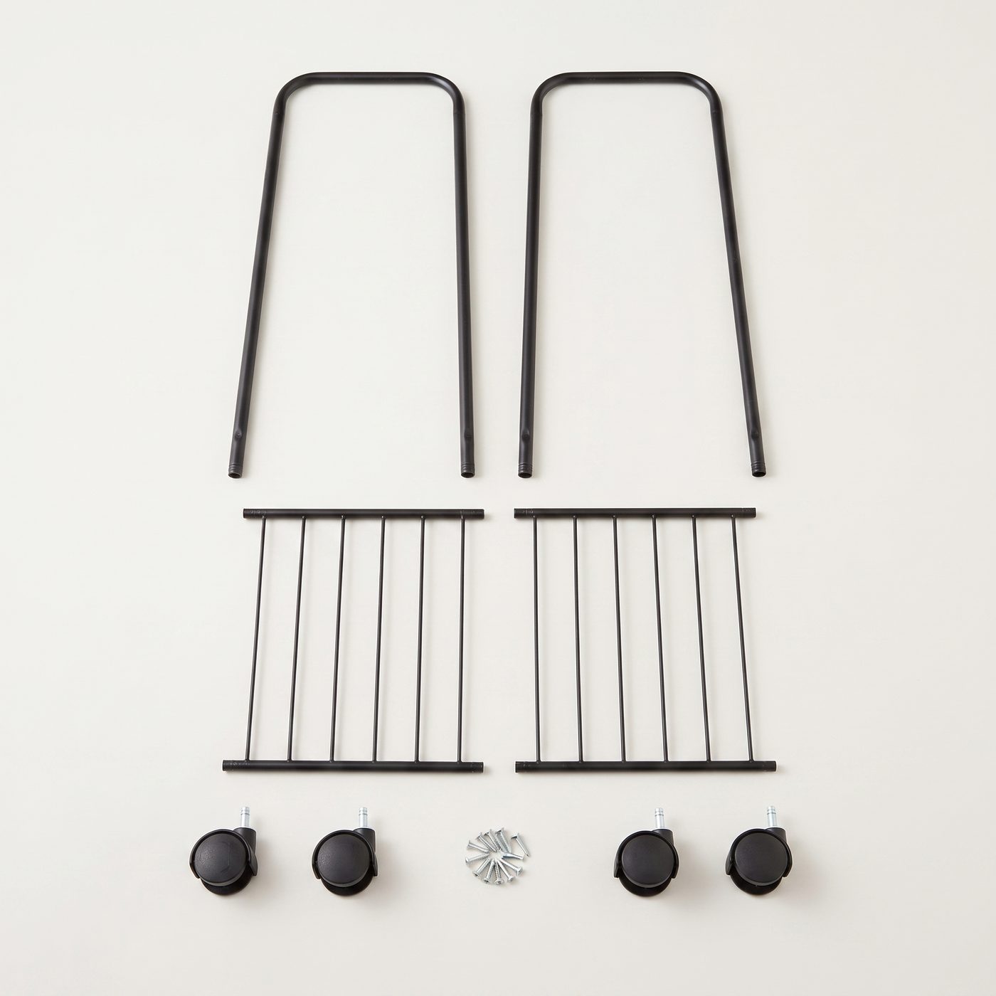All parts included: two side frames, two shelf grids, four caster wheels and screws
